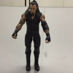 MATTEL WWE ACTION FIGURE THE UNDERTAKER.